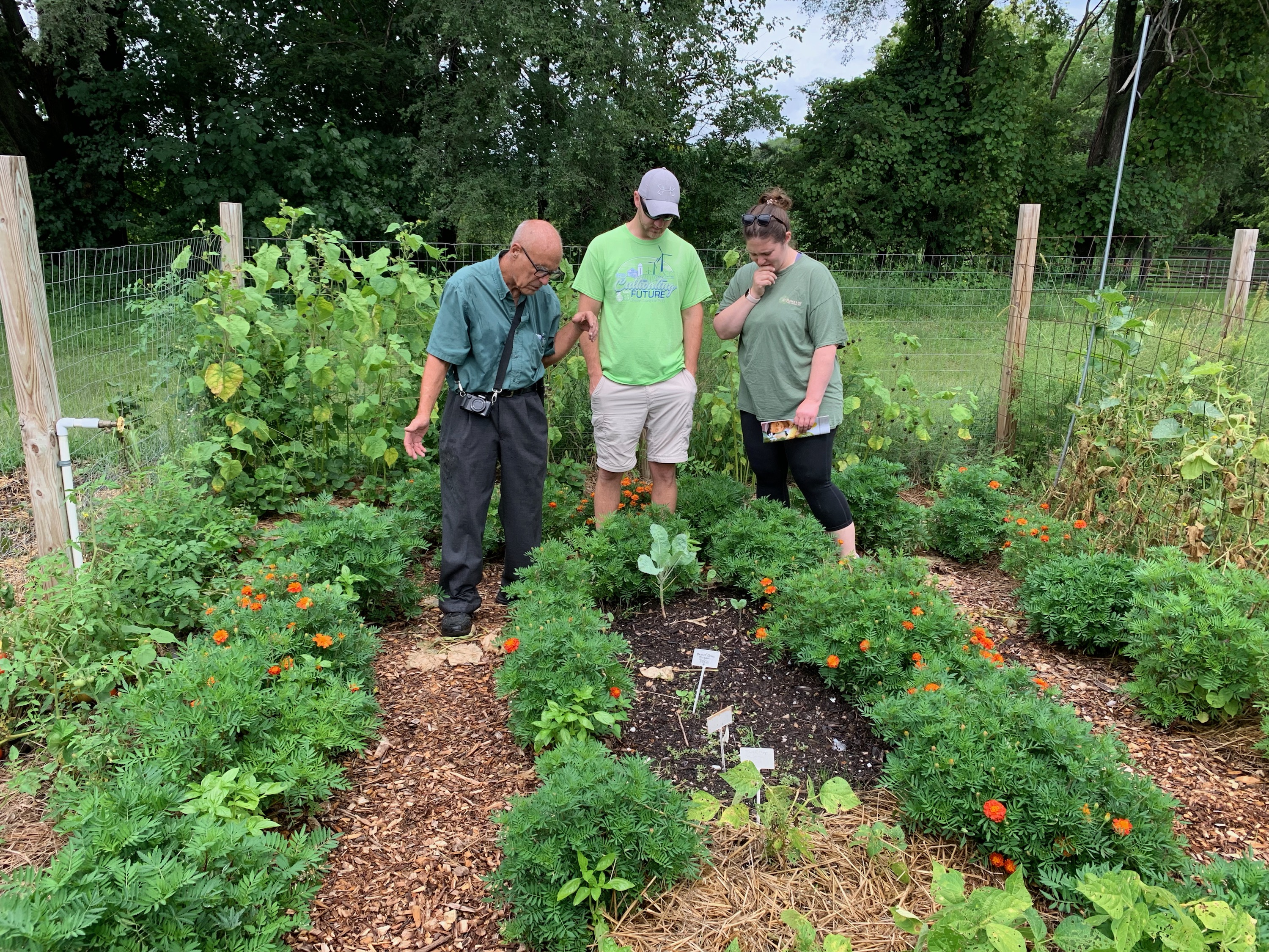 Community members in a garden during the 2022 farm crawl