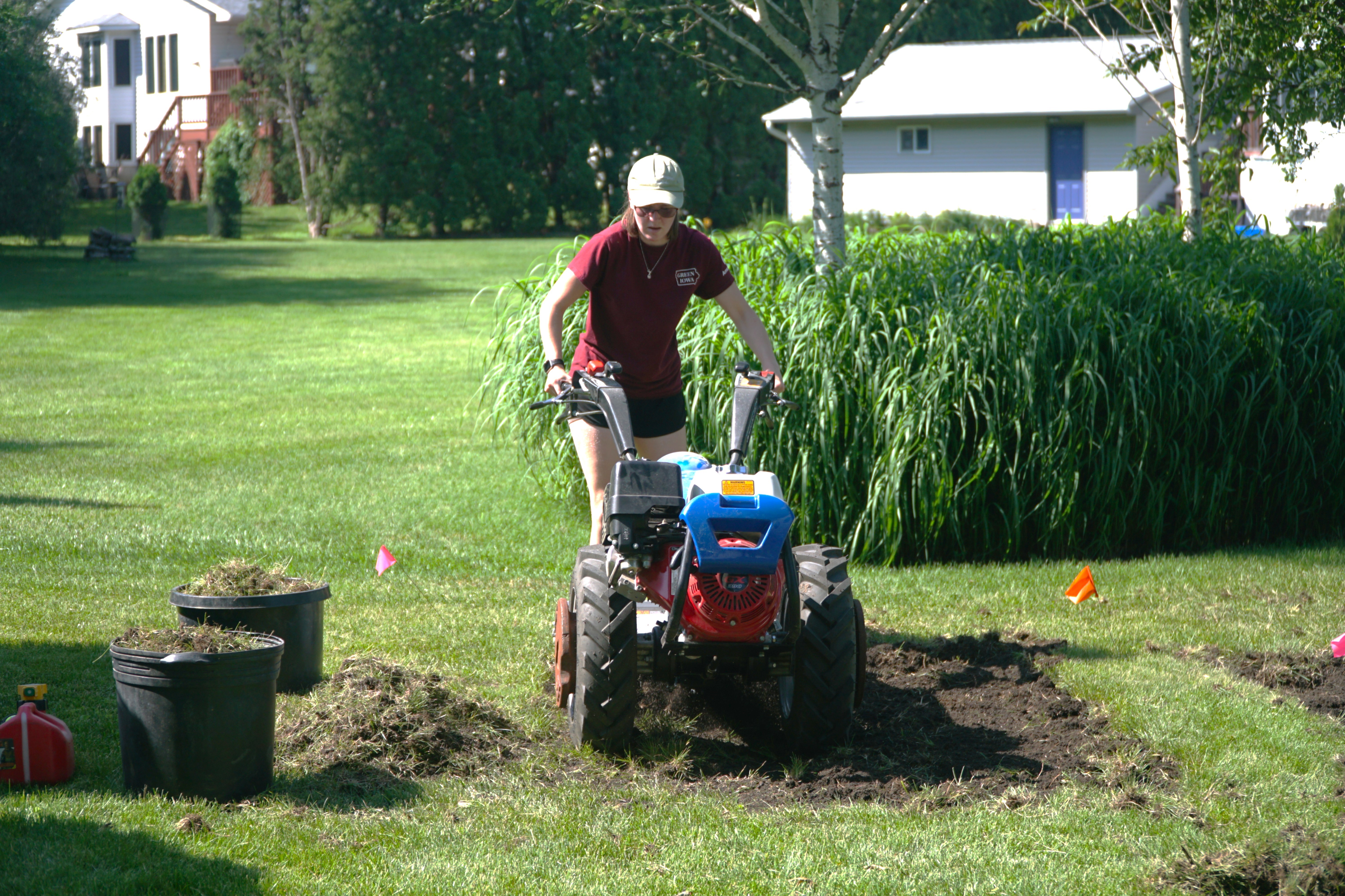 person tilling up grass